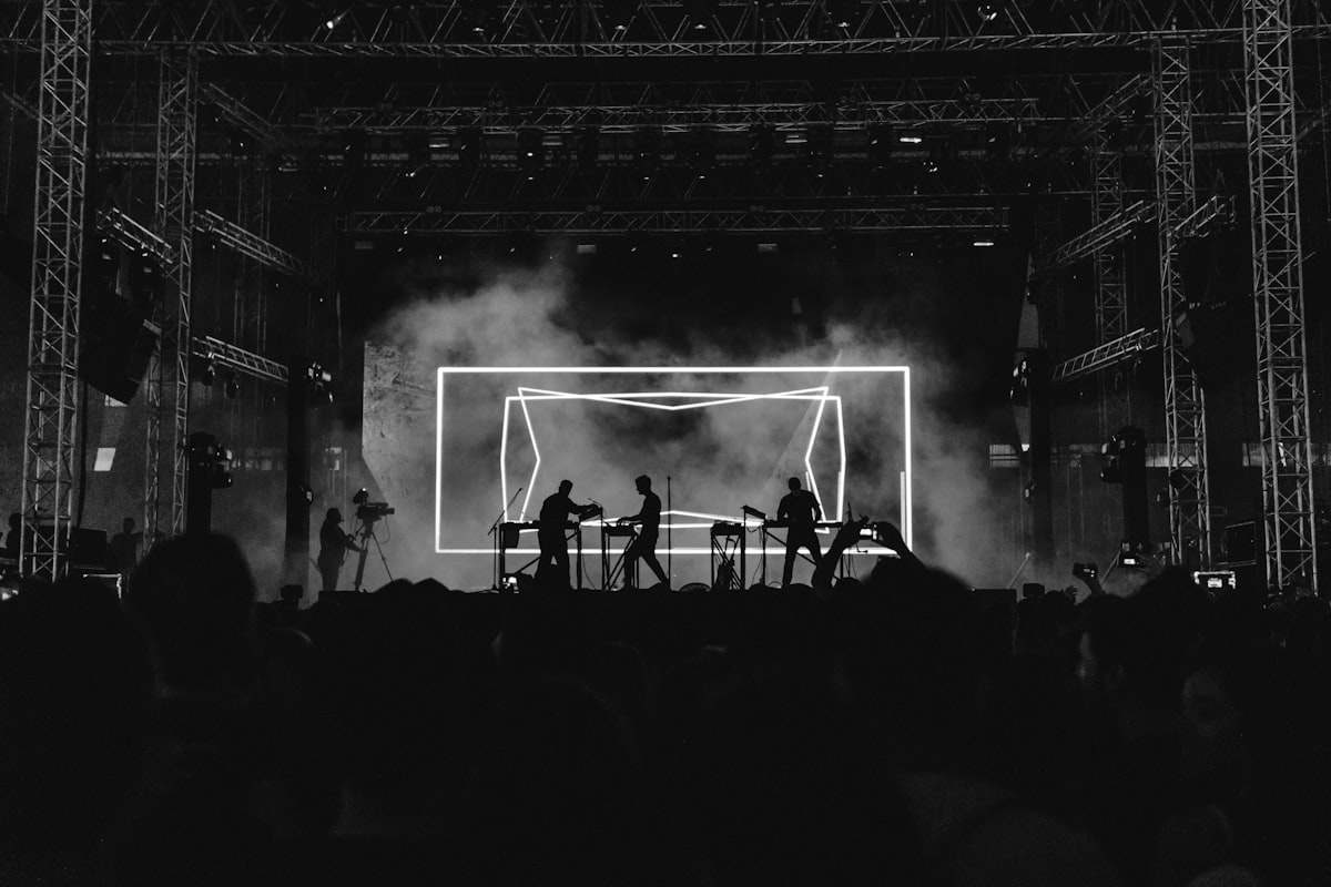 A live event stage with a large LED screen